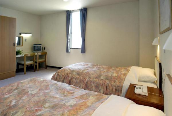 Business Hotel Prince Takamacu Pokoj fotografie